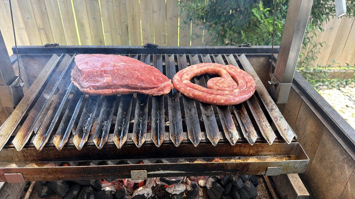 Brazilian barbecue with steak and sausage on the grill