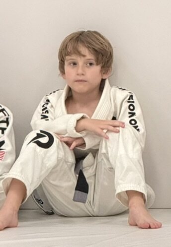 Ronnie's child wearing a Brazilian Jiu-Jitsu gi